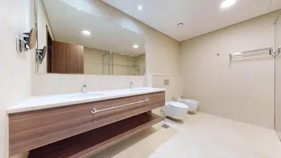 a bathroom with a sink and a toilet at Locations I Avani Palm View I Luxury 2 Bedroom I Sea View I Pool, Gym, Parking, Wi-Fi in Dubai