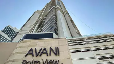 a tall building with aania sign in front of it at Locations I Avani Palm View I Luxury 2 Bedroom I Sea View I Pool, Gym, Parking, Wi-Fi in Dubai