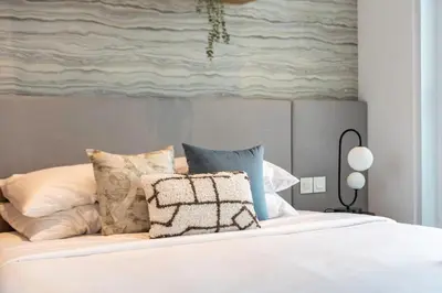 a bedroom with a white bed with pillows at GuestReady - Panoramic views from One JBR in Dubai
