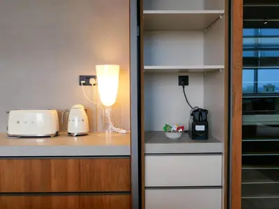 a kitchen with a counter with a lamp and toasters at High End 4BR Penthouse with Private Pool and Skyline Views in Dubai