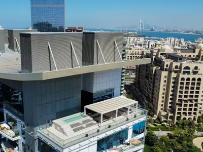 an overhead view of a building with a swimming pool at High End 4BR Penthouse with Private Pool and Skyline Views in Dubai