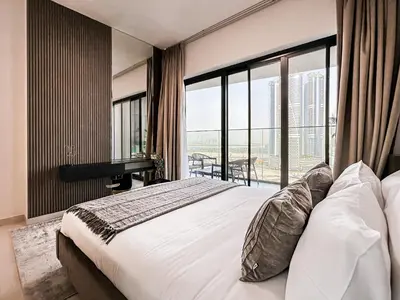 a bedroom with a large bed and a large window at Skyline Oasis - Business Bay with Burj Khalifa Vie in Dubai