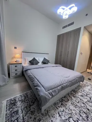 a bedroom with a large bed in a room at Azizi riviera in Dubai