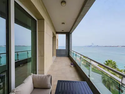a balcony of a building with a view of the ocean at Dream Palm Residence 3BR Luxury Apartment on Palm Jumeirah in Dubai