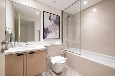a bathroom with a toilet and a sink and a shower at Luxury 4BR Villa, Bali Pool Retreat, Ruba A Ranches 3 in Dubai