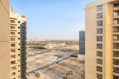 an aerial view of a construction site between two buildings at FIRST CLASS Studio Cozy & Chic Retreat in Dubai