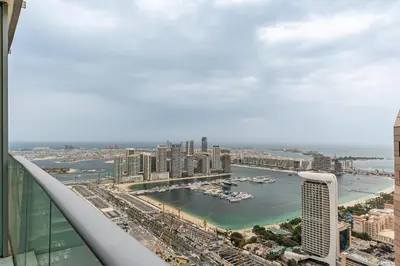 a view of a city from the top of a building at Highend 2BR Palm Sea View with Pool and Nightlife Marina in Dubai