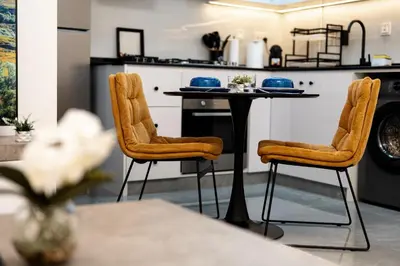 a kitchen with a table and two chairs at Dubai Marina - 1 BHK Stunning Apartment in Dubai