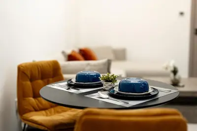 a table with blue dishes on top of it at Dubai Marina - 1 BHK Stunning Apartment in Dubai
