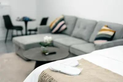a living room with a couch and a table at Dubai Marina - Lovely Studio Apartment in Dubai
