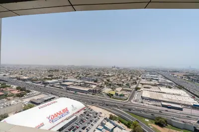 an aerial view of a city with a highway at Aykon City Panoramic Skyline View in Dubai