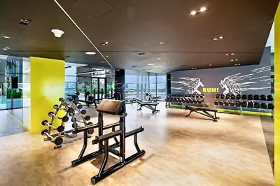 a gym with cardio equipment in a building at Aykon City Panoramic Skyline View in Dubai