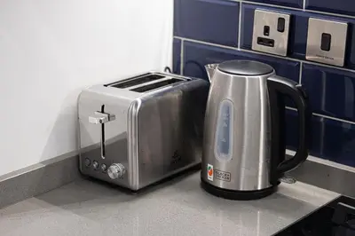 a toaster sitting on a counter in a kitchen at 2BR Dubai Gem steps from Dubai Mall & Burj in Dubai
