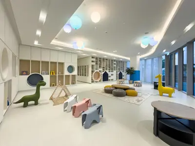 a childrens play room with dinosaurs and a table at Elegant 1BR I 1min walk to Burj Khalifa & Fountain in Dubai