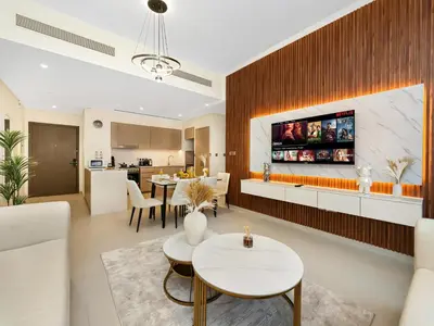 a living room with a couch and a table at EMAAR GRANDE 1BR Downtown I Steps to Fountain & Dubai Mall in Dubai