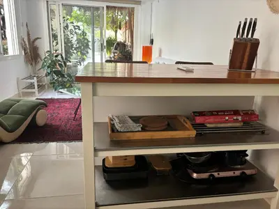 a kitchen with a counter with food on a shelf at Private Cottage with bbq area 5 min walk to beach! in Dubai