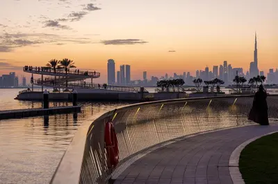 a view of a city skyline from a pier at Elegant Creekside 1BR with Panoramic Views in Dubai