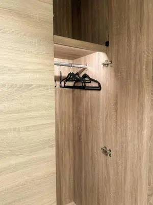 a pair of shoes are hanging on a door at The Designers Apartment Dubai Marina in Dubai