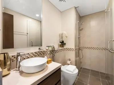 a bathroom with a sink and a shower at Burj Khalifa View Luxury Apt - 7 min to Dubai Mall in Dubai