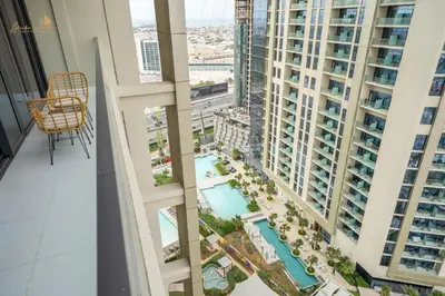 a view from the balcony of a building with a pool at Magnificent Canal View 2 Bhk 6 pax in Dubai