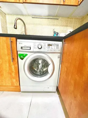 a washing machine in a kitchen with a sink at Stunning 2BR Marina View Apt Close to JBR in Dubai