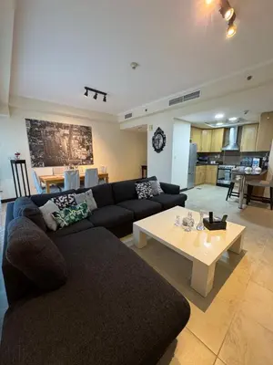 a living room with a couch and a coffee table at Click Stay - JLT - 2 Bedroom & Balcony Lakes View Entire Apartment -SS in Dubai