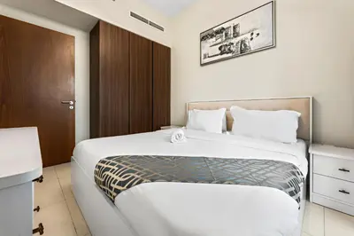 a bedroom with a large bed in a room at Apartment in Downtown Dubai in Dubai