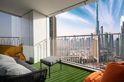 a room with a view of a city skyline at Luxury Stay Burj Views and Direct Dubai Mall Access in Dubai