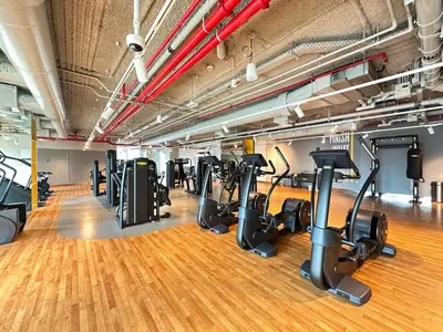 a gym with a row of treadmills and ellipticals at Luxury Stay Burj Views and Direct Dubai Mall Access in Dubai