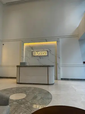 a room with a table with a sign on the wall at Sunlit serenity Studio Azizi Riviera in Dubai