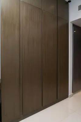 a row of wooden lockers in a room at Damac Maison Prive, Lake View - Free Parking in Dubai