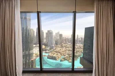 a view of a city from a window in a skyscraper at Maison Privee - Exclusive Apt with Unmatched Burj Khalifa Views in Dubai