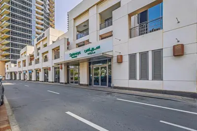 an empty street in front of a building at Downtown Retreat 1BR with Skyline Views & WiFi in Dubai