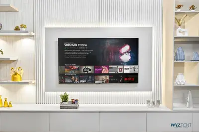 a framed picture of a movie on a wall at Lush 2BR & Maids City Walk with Burj Khalifa View in Dubai