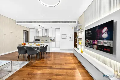 a kitchen and dining room with a table and chairs at Lush 2BR & Maids City Walk with Burj Khalifa View in Dubai