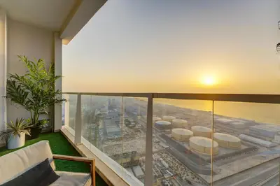 a balcony with a view of a city at HiGuest - New! Stunning sea view studio, Balcony, Pool in Dubai