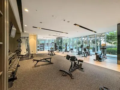 a gym with treadmills and exercise equipment in a building at Luxury 3BR Apartment with Burj Khalifa Views in Dubai