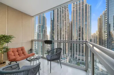 a balcony with a view of a city at 2-Bedroom Apartment with Full Burj Khalifa & Opera House Views Just 9 Min Walk to Dubai Mall! in Dubai