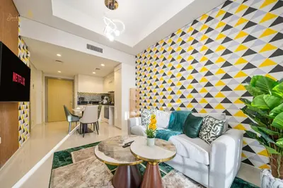 a living room with a couch and a table at Elegant Sunset View 3BHK 7pax in Dubai