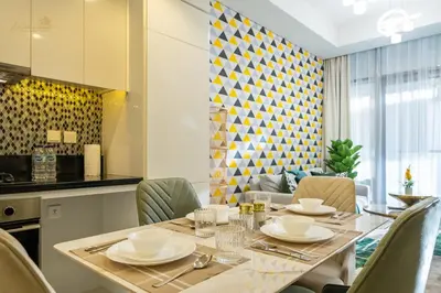 a dining room with a table and chairs at Elegant Sunset View 3BHK 7pax in Dubai