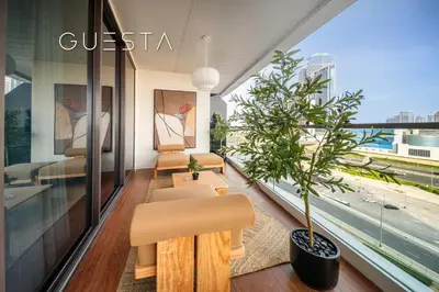 a lobby of a building with a plant at Terraces Marasi Drive, Business Bay in Dubai
