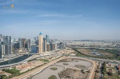 an aerial view of a city with tall buildings at Classic Canal View 2 Bhk 6pax in Dubai