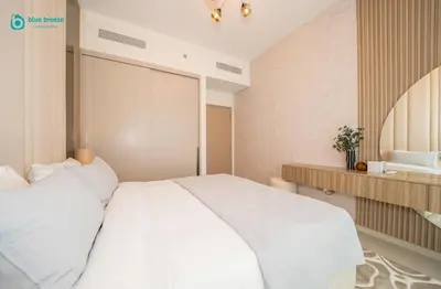 a bedroom with a large white bed in it at Blue Breeze - Luxury Apartment in Downtown in Dubai