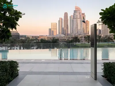 a view of a city skyline from a pool at Blue Breeze - Luxury Apartment in Downtown in Dubai