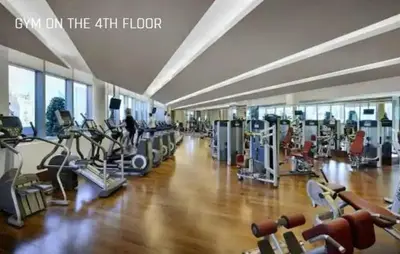 a gym with a bunch of treadmills and machines at JW Marriot Hotel Residence - Two bedroom Suite in Dubai