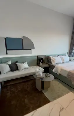 a living room with a couch and a bed at Cozy Dubai Studio I Prime Spot in Dubai