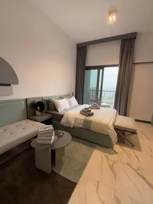 a hotel room with a bed and a couch at Cozy Dubai Studio I Prime Spot in Dubai
