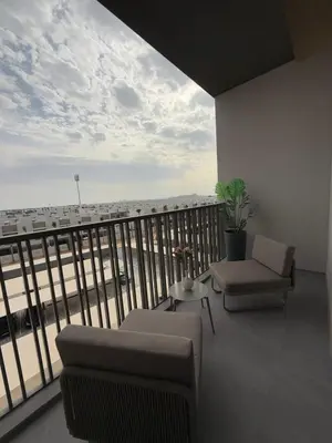a living room with a balcony with a view of the ocean at Cozy Dubai Studio I Prime Spot in Dubai