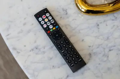 a remote control sitting on top of a counter at Modern Meydan Studio Near Dubai Mall & Downtown in Dubai