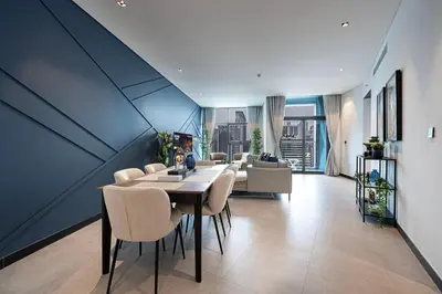 a dining room with a table and chairs at Luxury 2BR Burj Khalifa and Canal View Pool Jacuzzi in Dubai